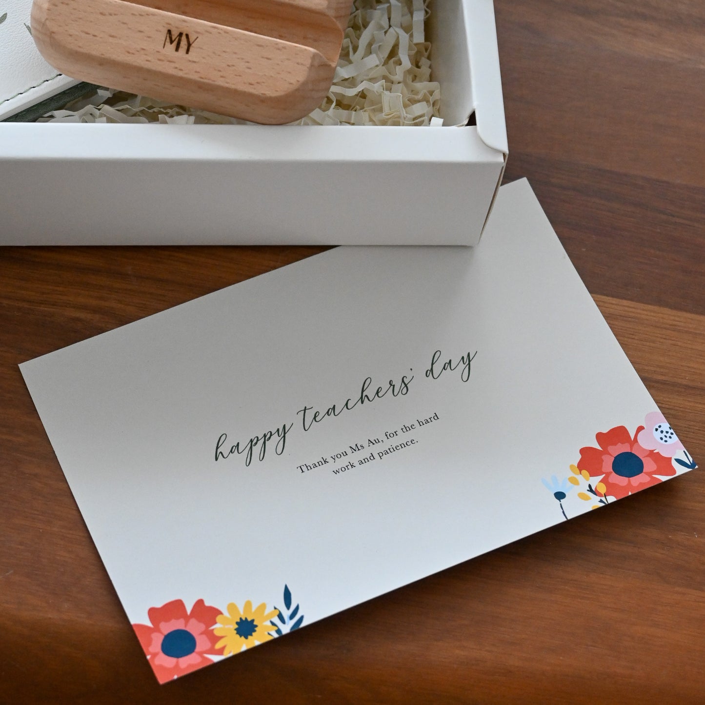 Gift set with wooden phone stand, card, and botanical design notebook for teachers' day singapore