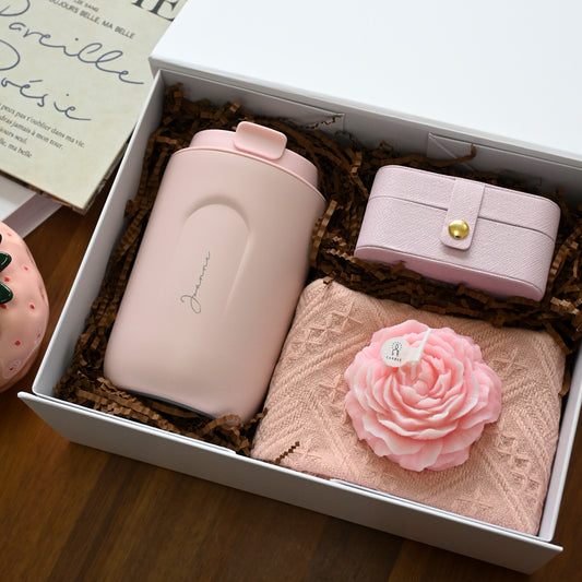 Personalised pink tumbler, pink jewellery organiser, pink tea towel and pink rose candle in a white gift box