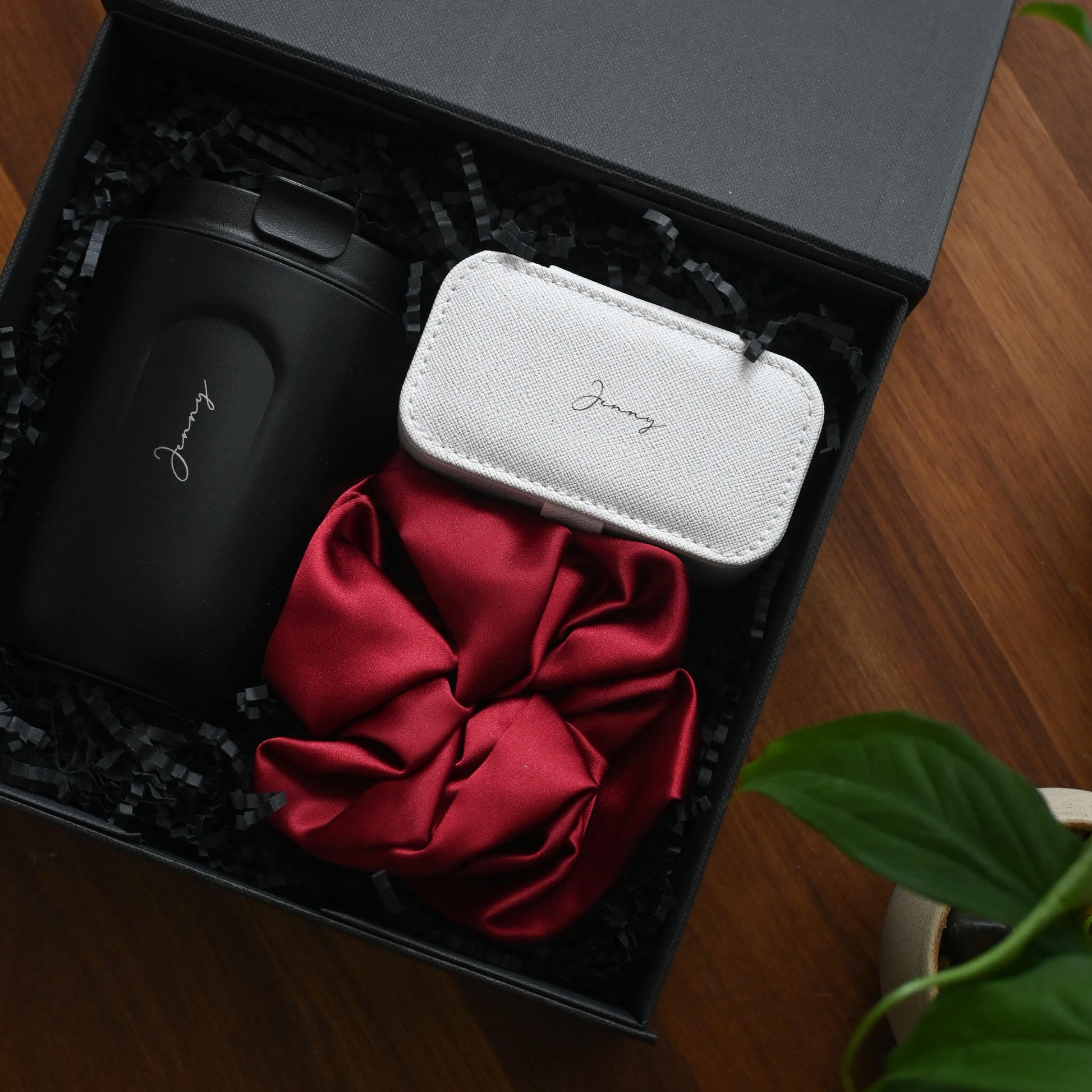 Personalised Black tumbler, white jewellery organiser, and red scrunchie in a black gift box 