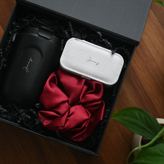 Personalised Black tumbler, white jewellery organiser, and red scrunchie in a black gift box 